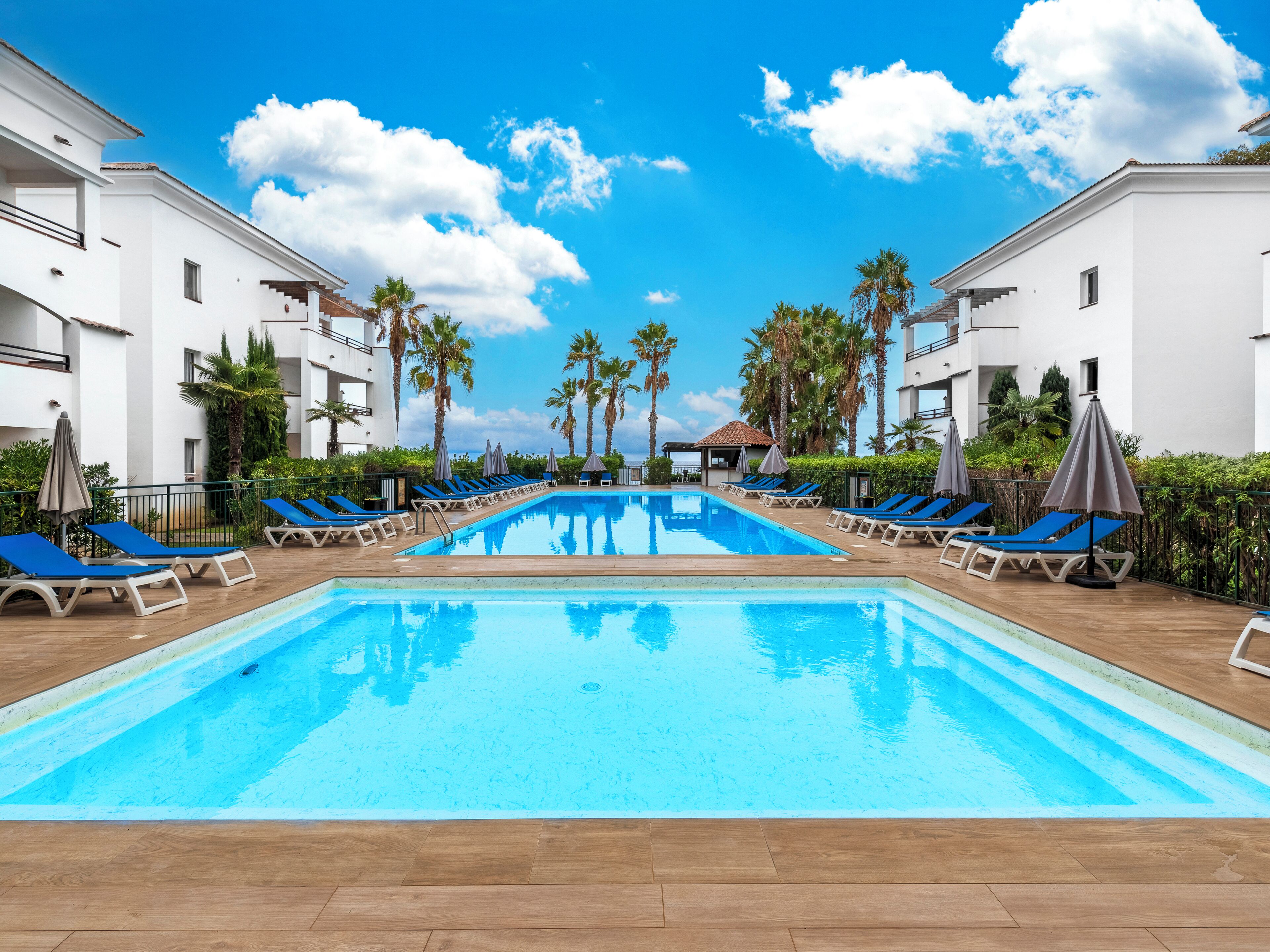 Seasonal outdoor pool, pool loungers