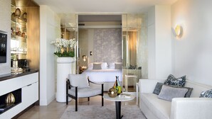 A modern living room with a sofa, a chair, a coffee table, and a TV. - Villa Marina Capri - Preferred Hotels & Resorts (Capri)