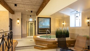 A spa area with a hot tub, wooden steps, and seating. - Vihula Manor Country Club and Spa (Vihula)