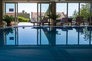 Indoor pool, open 9 AM to 7:00 PM, pool loungers