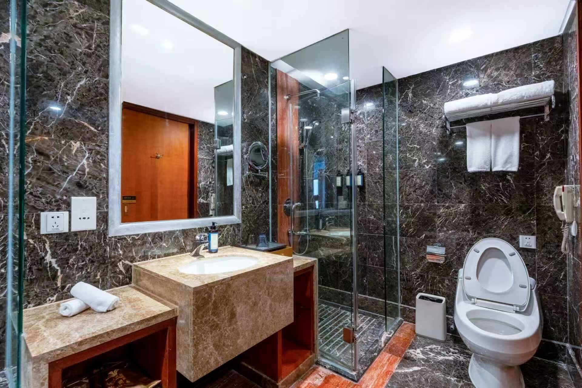 Separate tub and shower, hair dryer, bathrobes, slippers