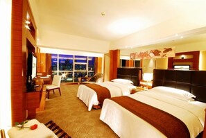 A hotel room with two beds, a desk, a chair, and a large window offering a city view. - Empark Grand Hotel Xian (Xi'an)