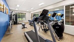 A gym with treadmills, elliptical machines, and weight equipment. - Comfort Inn & Suites High Point - Archdale (High Point)