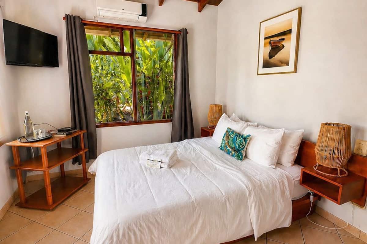 Basic Double Room | Premium bedding, blackout drapes, individually decorated