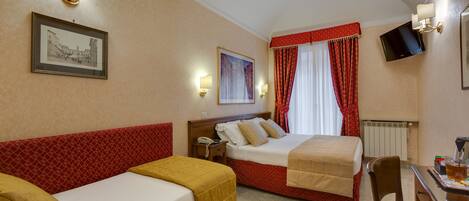 Quadruple Room | Down comforters, in-room safe, desk, blackout drapes