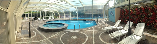 Indoor pool, outdoor pool, pool umbrellas, pool loungers