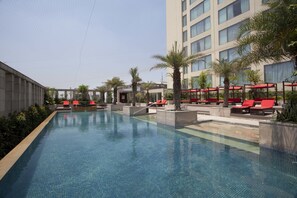 Outdoor pool, open 8:00 AM to 7:00 PM, pool loungers