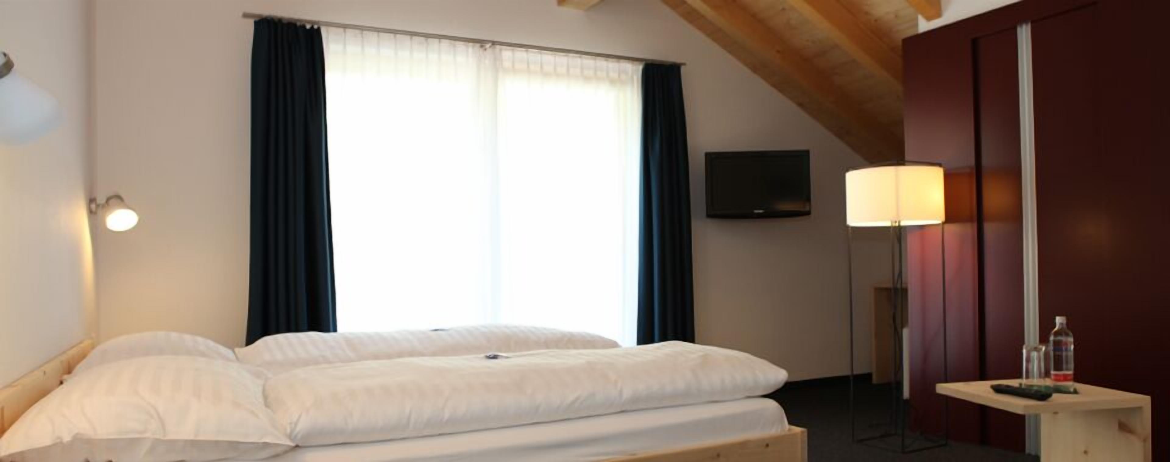 hypo-allergenic bedding, down duvets, in-room safe, blackout curtains