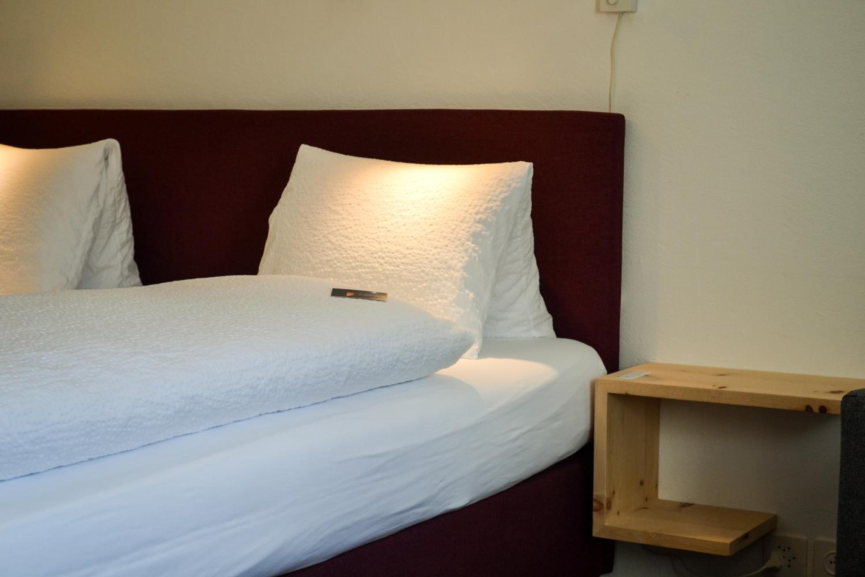 hypo-allergenic bedding, down duvets, in-room safe, blackout curtains