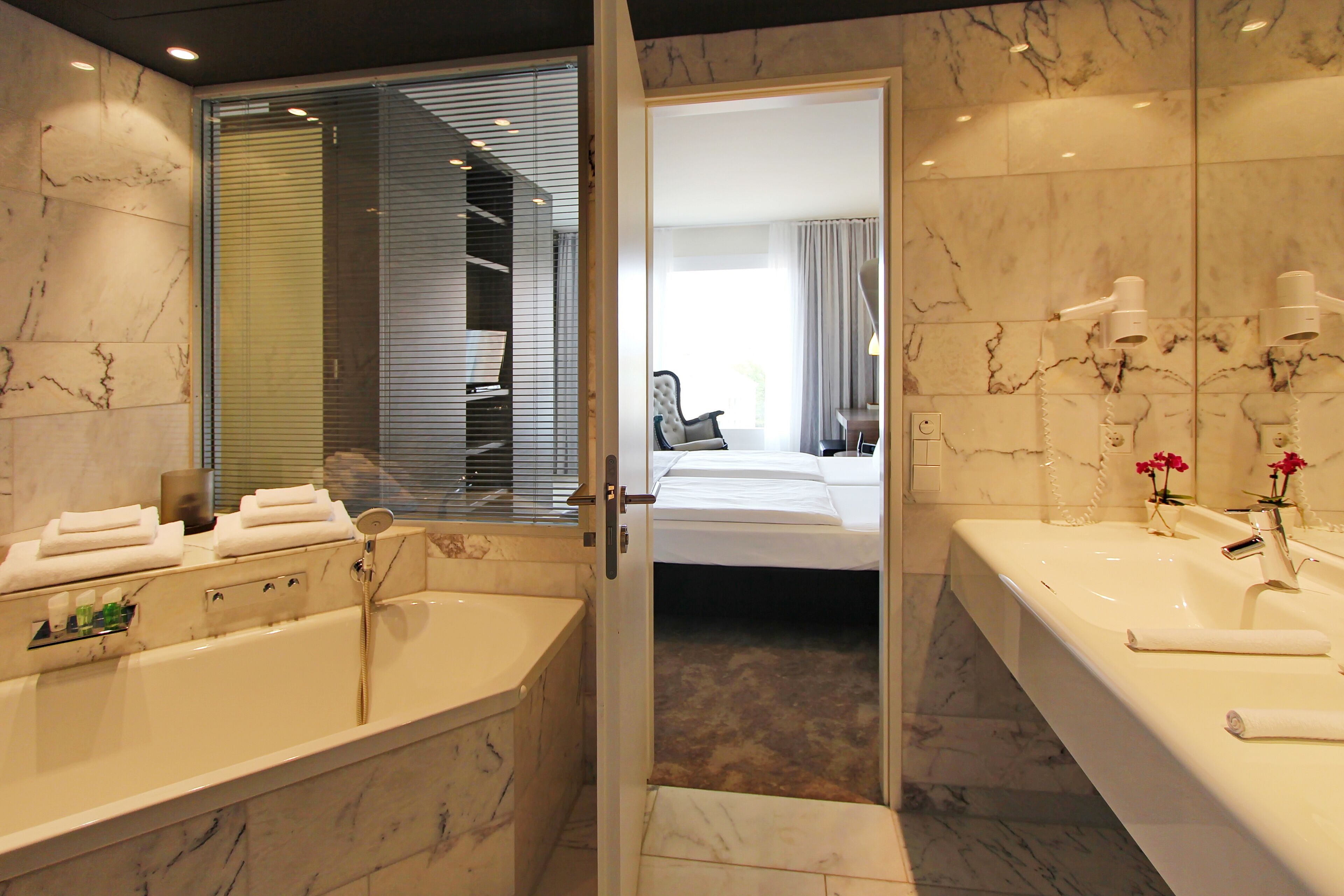 suite | bathroom | eco-friendly toiletries, hair dryer, towels