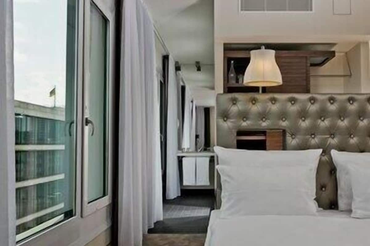 Hypo-allergenic bedding, pillow-top beds, in-room safe, desk