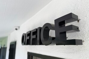 A wall-mounted sign with the word 'OFFICE' in large, bold letters. - Hyland Motel Van Nuys (Van Nuys)