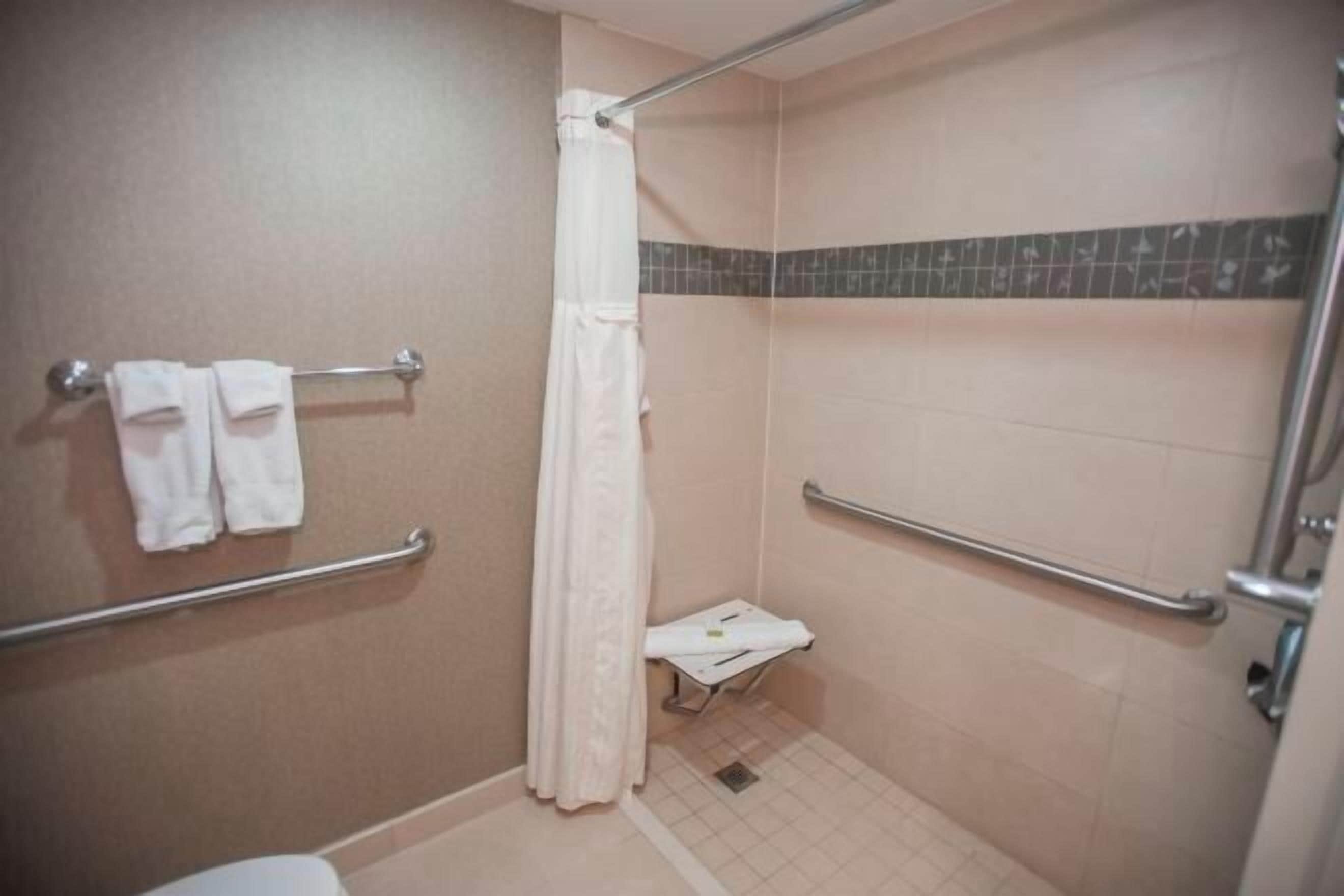 Bathroom | Designer toiletries, hair dryer, towels, soap