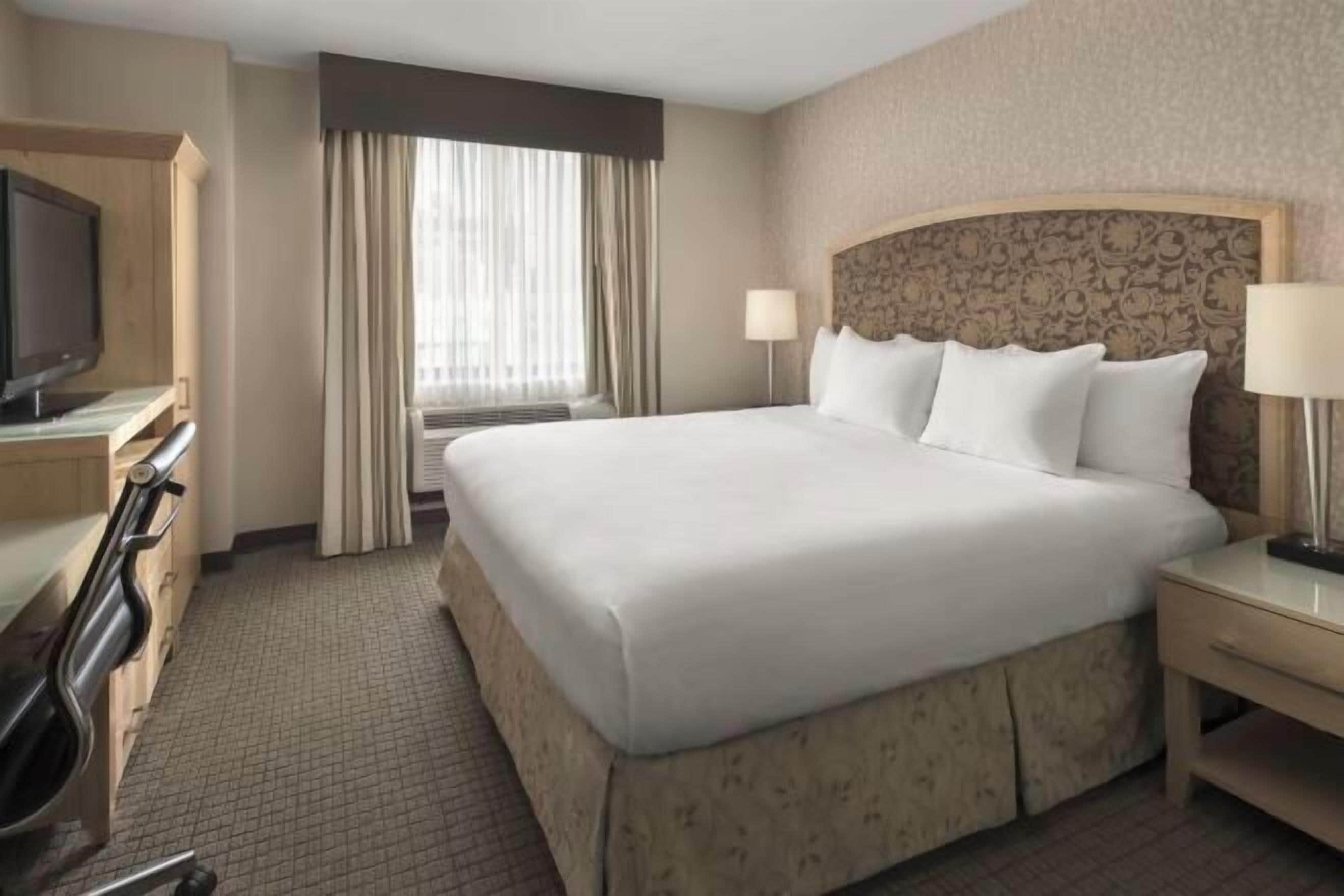 Hypo-allergenic bedding, in-room safe, blackout curtains