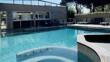 Indoor pool, outdoor pool, open 10:00 AM to 8:00 PM, pool loungers