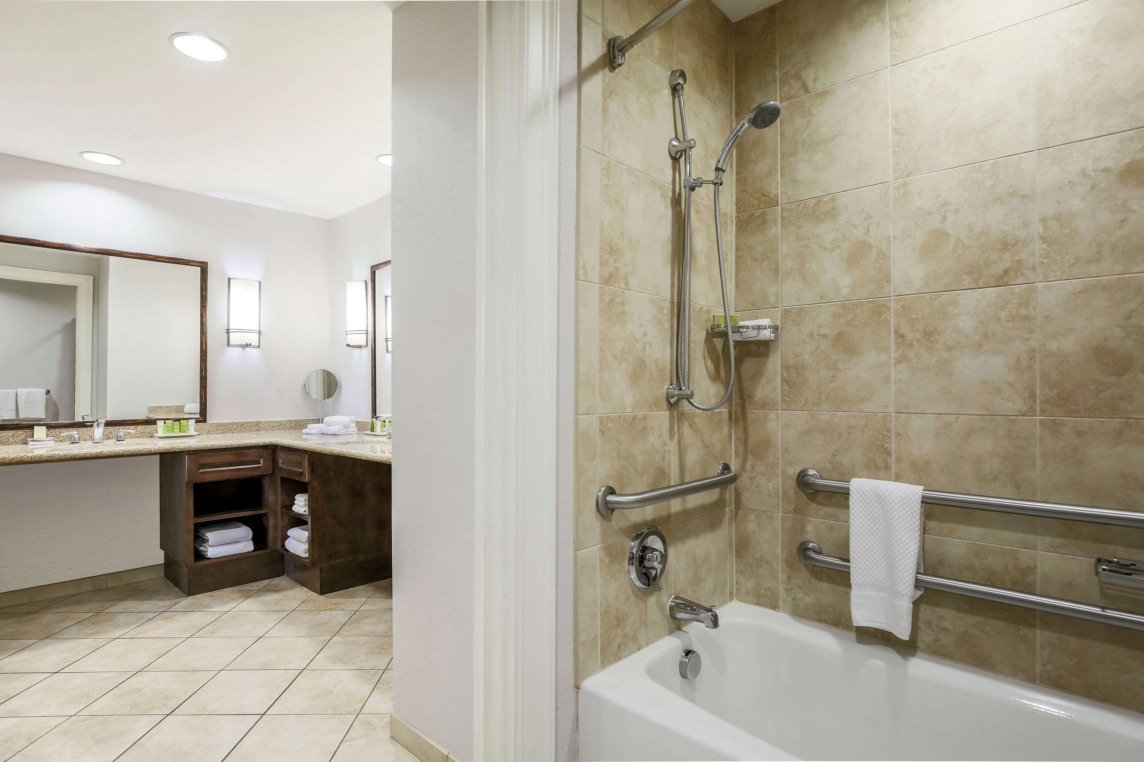 shower, designer toiletries, hair dryer, towels