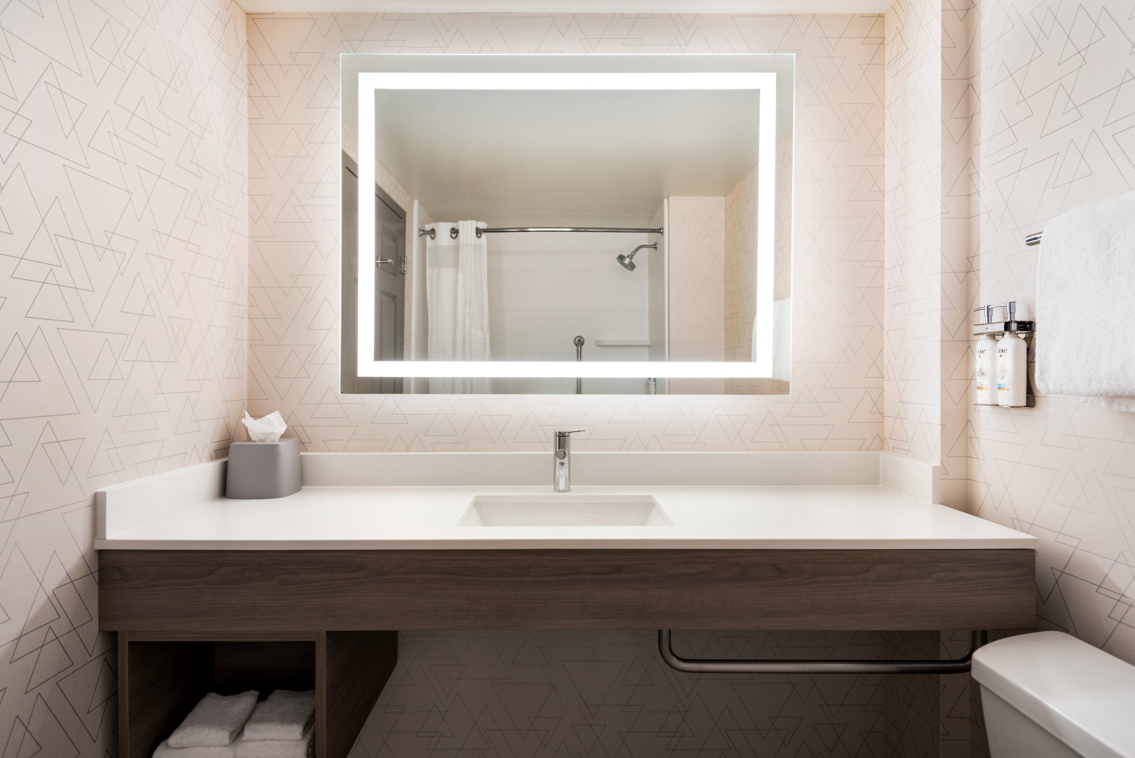 combined shower/bathtub, deep-soaking bathtub, designer toiletries