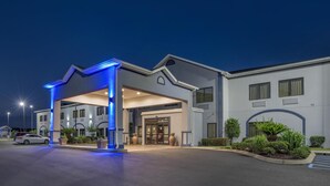 A modern hotel entrance with a covered driveway, large windows, and a well-lit facade. - Best Western Opp Inn (Opp)