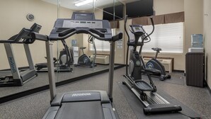 A gym with treadmills, exercise bikes, and a mirrored wall. - Best Western Opp Inn (Opp)