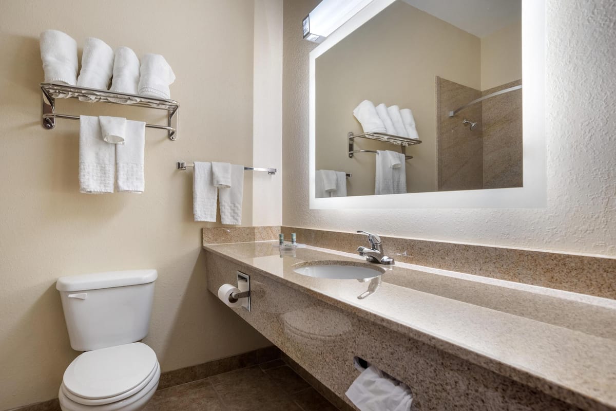 standard room, 2 queen beds, non smoking, refrigerator & microwave (with single sofabed) | bathroom | combined shower/bathtub, free toiletries, hair dryer, towels