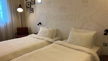 Desk, laptop workspace, blackout drapes, soundproofing