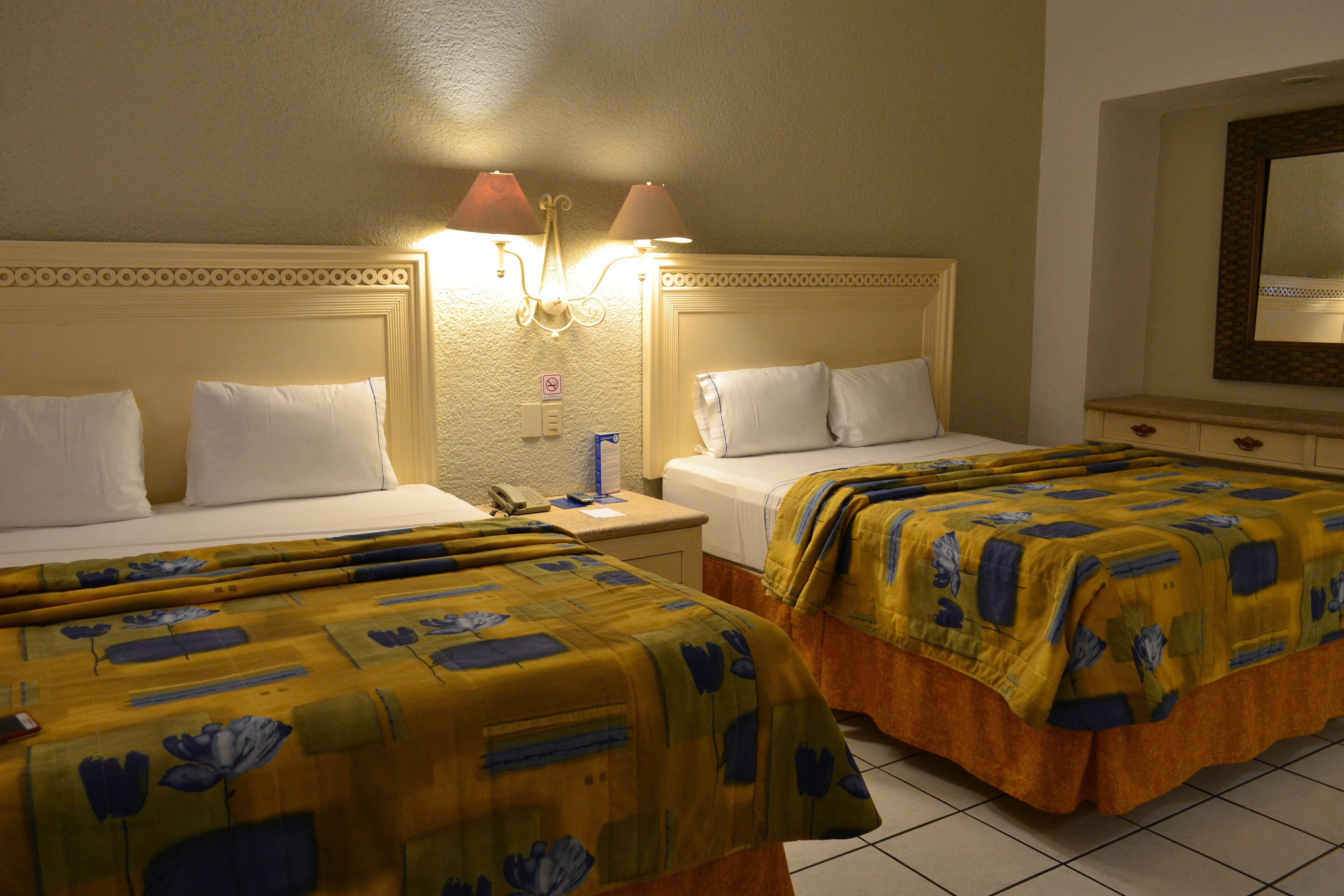 standard room, 2 double beds | desk, blackout curtains, iron/ironing board, free cots/infant beds