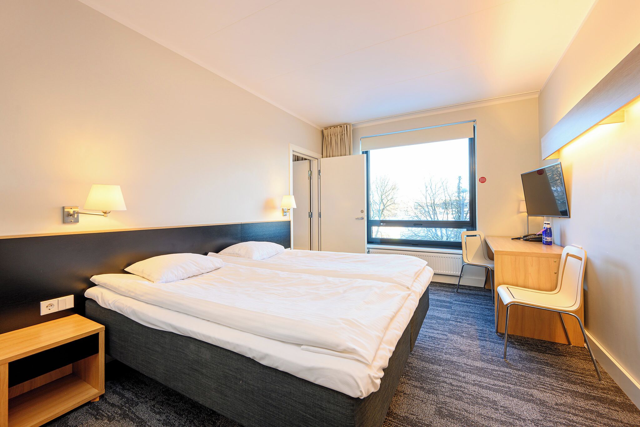 family room | hypo-allergenic bedding, desk, laptop workspace, soundproofing