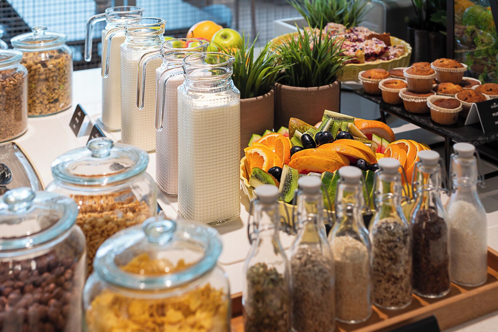 A buffet with various food items and condiments.