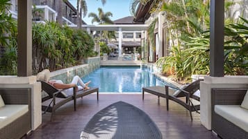Outdoor pool, open 7:00 AM to 9:00 PM, pool umbrellas, pool loungers