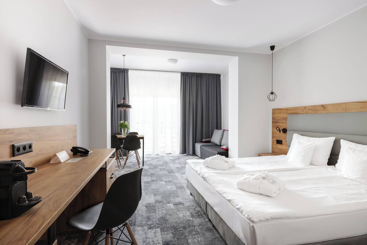 family room, 1 queen bed with sofa bed | bathroom | hair dryer, towels