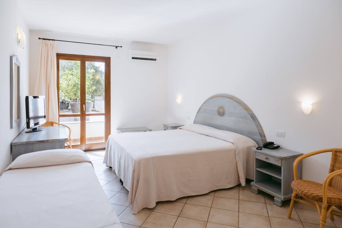 standard triple room | select comfort beds, minibar, in-room safe, desk