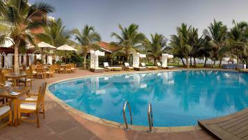 Outdoor pool, open 6 AM to 8 PM, free cabanas, pool umbrellas