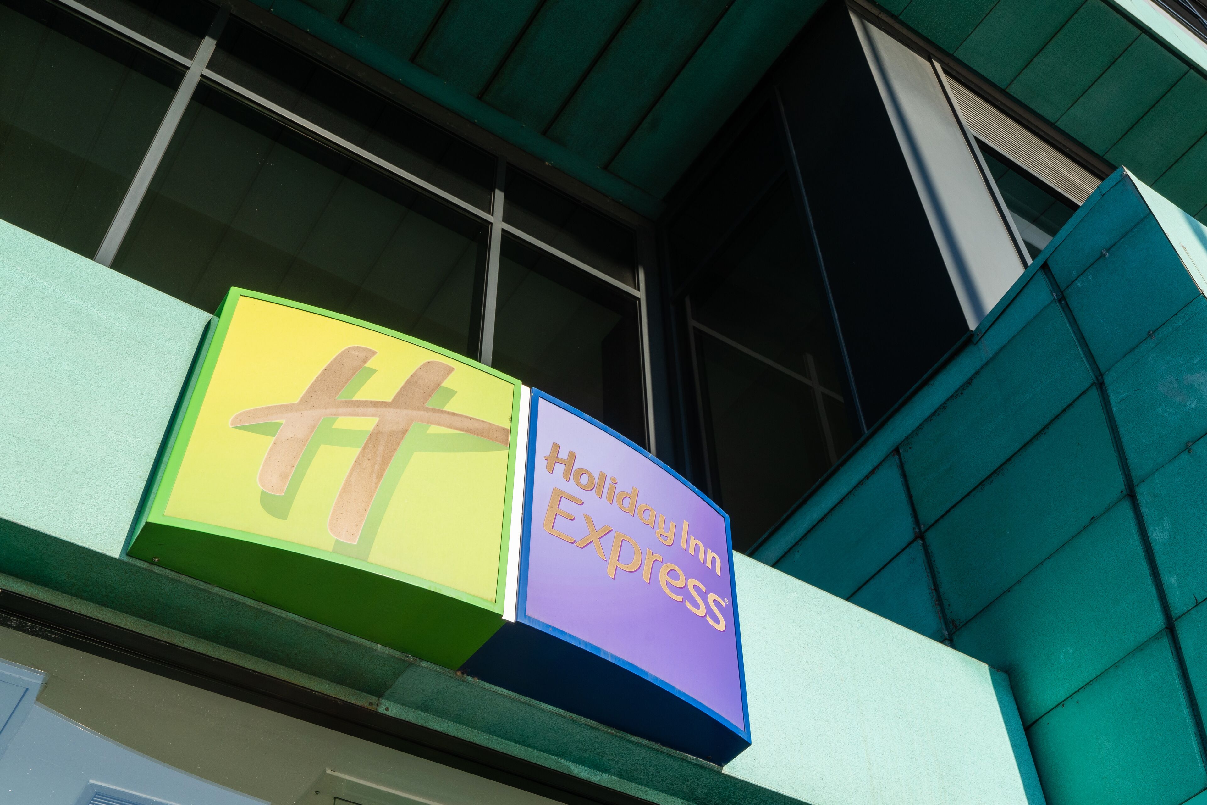 A Holiday Inn Express sign on a building facade.