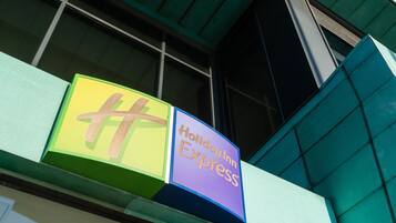 A Holiday Inn Express sign on a building facade.