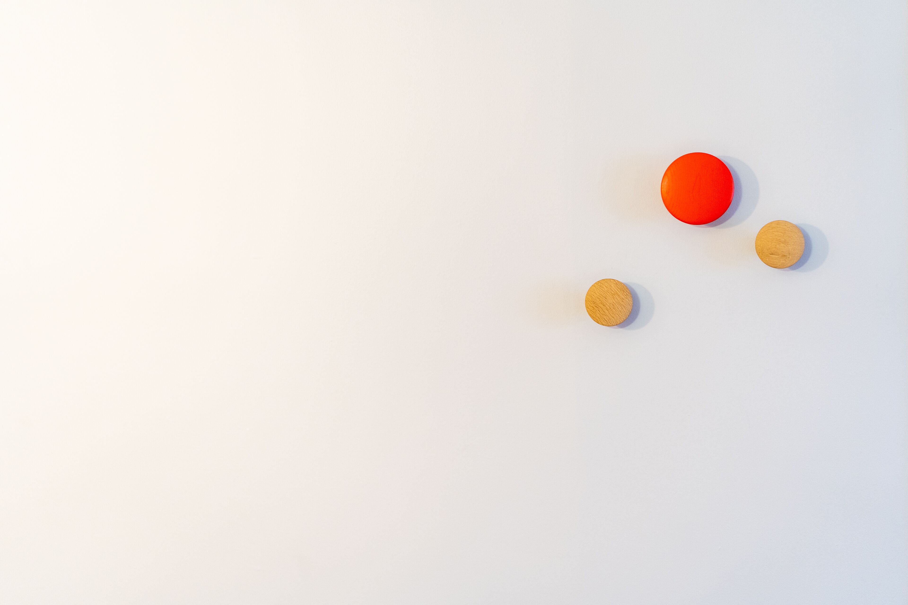 Three round objects on a plain white background.