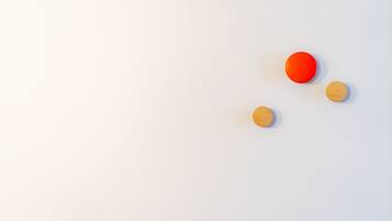 Three round objects on a plain white background.