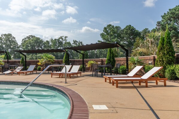 Seasonal outdoor pool, open 9:00 AM to 7:00 PM, pool umbrellas