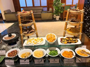A buffet with various dishes including peanuts, tofu, and pickles. - Ramana Saigon Hotel (Ho Chi Minh City)