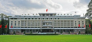 A large, modern building with a symmetrical facade, multiple windows, and a central entrance.