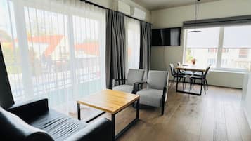 Comfort Apartment | Minibar, in-room safe, desk, iron/ironing board