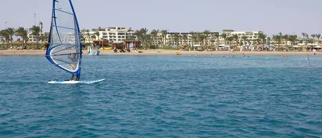 A beach with a windsurfing activity.