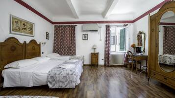 Standard Quadruple Room | Minibar, in-room safe, desk, soundproofing