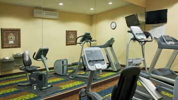 A fitness center with treadmills, an elliptical, and a stationary bike.