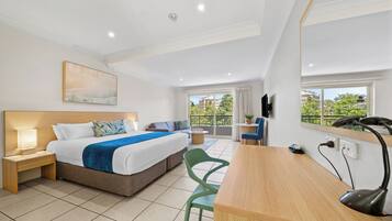 Premium bedding, desk, laptop workspace, blackout curtains