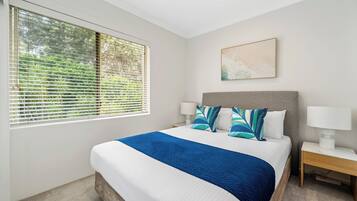 Premium Penthouse | Premium bedding, desk, laptop workspace, blackout drapes