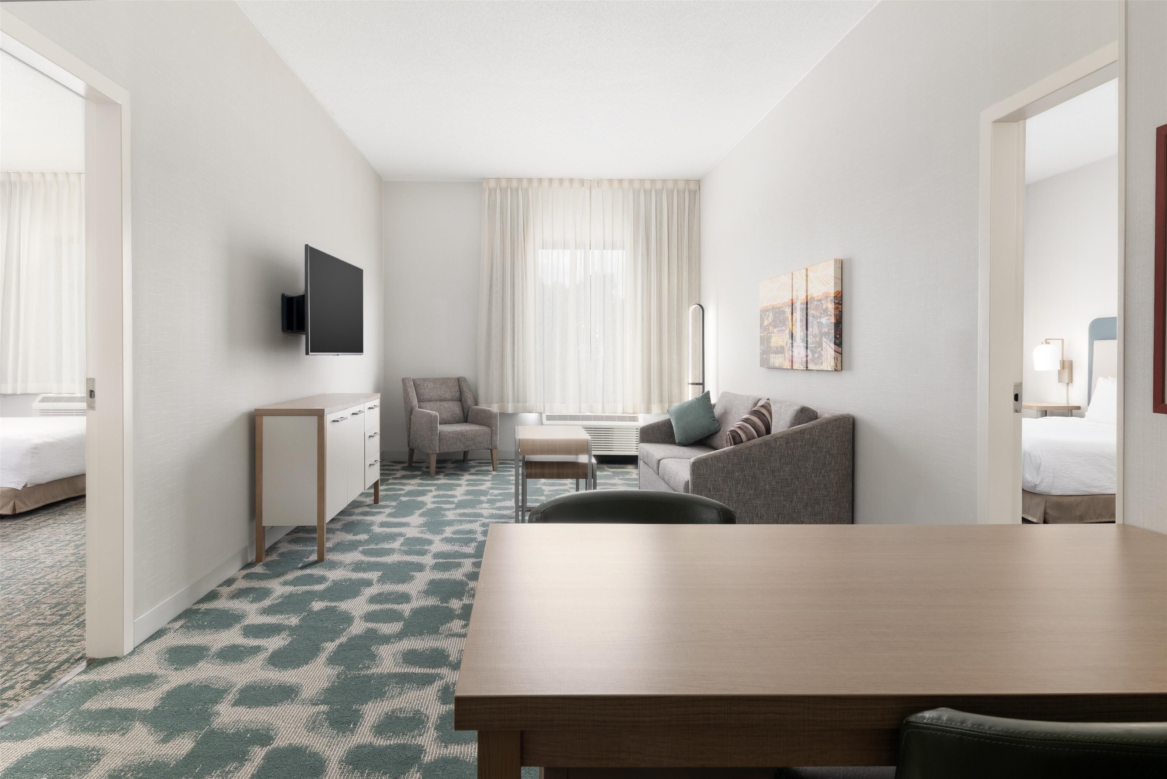 suite, 2 bedrooms, accessible, bathtub | living area | 50-inch flat-screen tv with cable channels