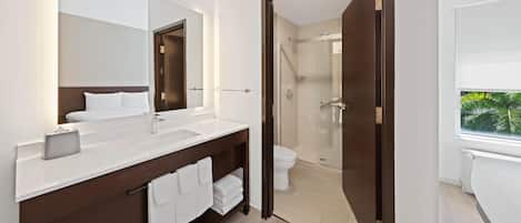 Shower, designer toiletries, hair dryer, towels