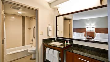 Combined shower/tub, designer toiletries, hair dryer, towels