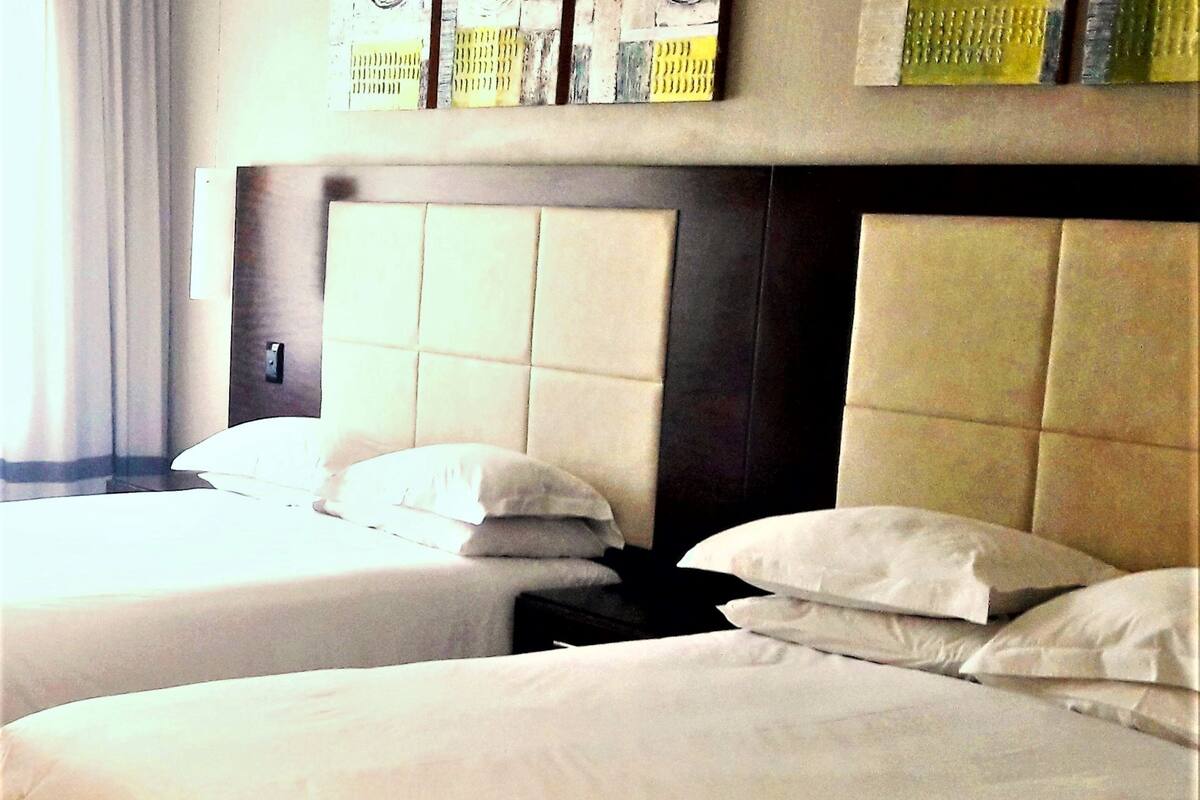 family room | 1 bedroom, in-room safe, desk, blackout curtains