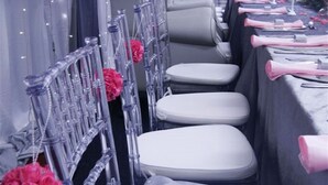A row of tables with white chairs and pink napkins, decorated with red flowers. - Premier Splendid Inn Pinetown (Pinetown)